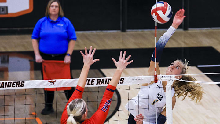 Notre Dame's Teagan Kondik (1) hits the ball against St. Henry in the third set of the Ninth Region volleyball final at Ryle High School Oct. 29, 2025.