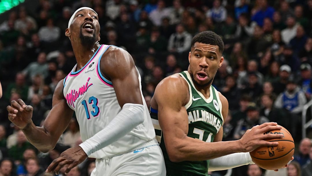 Jan 23, 2025; Milwaukee, Wisconsin, USA; Milwaukee Bucks forward Giannis Antetokounmpo (34) looks for a shot against Miami Heat center Bam Adebayo (13) in the second quarter at Fiserv Forum. Mandatory Credit: Benny Sieu-Imagn Images