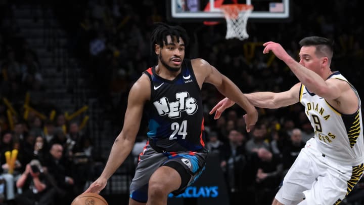 Apr 3, 2024; Brooklyn, New York, USA; Brooklyn Nets guard Cam Thomas (24) drives to the basket while being defended by Indiana Pacers guard T.J. McConnell (9) during the third quarter at Barclays Center. Mandatory Credit: John Jones-USA TODAY Sports