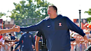 Aug 29, 2025; Champaign, Illinois, USA;  Illinois Fighting Illini head coach Bret Bielema leads his team during the Illini Walk before an NCAA football game against the Western Illinois Leathernecks at Memorial Stadium. Mandatory Credit: Ron Johnson-Imagn Images