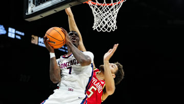 Nov 25, 2025; Las Vegas, NV, USA; Gonzaga Bulldogs guard Tyon Grant-Foster (7) drives past Maryland Terrapins center Collin Metcalf (45) in the first half in a 2025 Players Era Festival group play game at MGM Grand Garden Arena. 