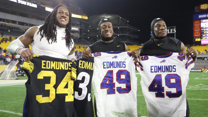  Brothers Buffalo Bills middle linebacker Tremaine Edmunds (left) and Pittsburgh Steelers strong safety Terrell Edmunds (middle) and running back Trey Edmunds (right) exchange jerseys after the game at Heinz Field.