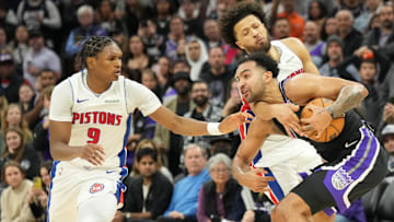 Detroit Pistons guard Cade Cunningham (2) fouls Sacramento Kings forward Trey Lyles (41) with Detroit Pistons forward Ausar Thompson (9) during the fourth quarter at Golden 1 Center. Mandatory Credit: Kelley L Cox-Imagn Images