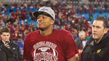 Dec 6, 2014; Charlotte, NC, USA; Florida State Seminoles quarterback Jameis Winston (5) walks off the field after defeating the Georgia Tech Yellow Jackets at Bank of America Stadium. FSU defeated Georgia Tech 37-35. Mandatory Credit: Jeremy Brevard-Imagn Images