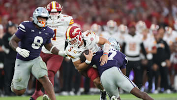 Aug 23, 2025; Dublin, IRELAND; Iowa State quarterback Rocco Becht is tackled by VJ Payne of Kansas State during the Aer Lingus Classic between Iowa State and Kansas State at Aviva Stadium. Mandatory Credit: Laszlo Geczo/INPHO via Imagn Images