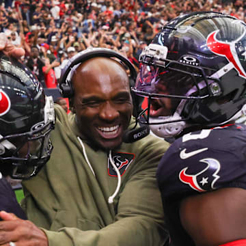Houston Texans head coach DeMeco Ryans and linebacker Azeez Al-Shaair celebrate.