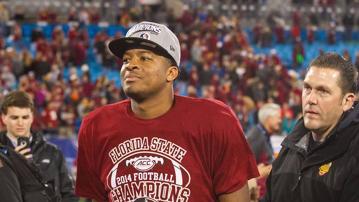 Dec 6, 2014; Charlotte, NC, USA; Florida State Seminoles quarterback Jameis Winston (5) walks off the field after defeating the Georgia Tech Yellow Jackets at Bank of America Stadium. FSU defeated Georgia Tech 37-35. Mandatory Credit: Jeremy Brevard-Imagn Images
