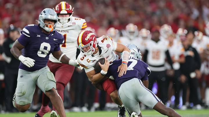 Aug 23, 2025; Dublin, IRELAND; Iowa State quarterback Rocco Becht is tackled by VJ Payne of Kansas State during the Aer Lingus Classic between Iowa State and Kansas State at Aviva Stadium. Mandatory Credit: Laszlo Geczo/INPHO via Imagn Images