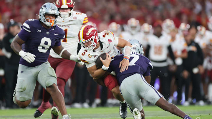 Aug 23, 2025; Dublin, IRELAND; Iowa State quarterback Rocco Becht is tackled by VJ Payne of Kansas State during the Aer Lingus Classic between Iowa State and Kansas State at Aviva Stadium. 