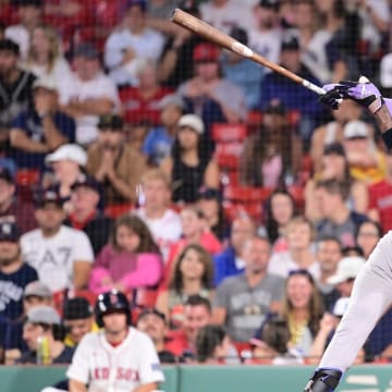 Jul 28, 2024; Boston, Massachusetts, USA; New York Yankees center fielder Jazz Chisholm Jr (13) hits a single against the Boston Red Sox during the ninth inning at Fenway Park. 