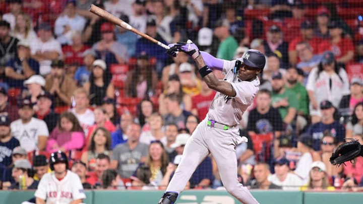 Jul 28, 2024; Boston, Massachusetts, USA; New York Yankees center fielder Jazz Chisholm Jr (13) hits a single against the Boston Red Sox during the ninth inning at Fenway Park. 