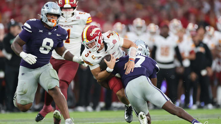 Aug 23, 2025; Dublin, IRELAND; Iowa State quarterback Rocco Becht is tackled by VJ Payne of Kansas State during the Aer Lingus Classic between Iowa State and Kansas State at Aviva Stadium. Mandatory Credit: Laszlo Geczo/INPHO via Imagn Images