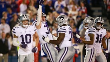 Kansas State junior tight end Ben Sinnott (34) celebrates a touchdown during the first quarter of Saturday's Sunflower Showdown against Kansas inside David Booth Kansas Memorial Stadium.