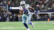 Nov 23, 2025; Arlington, Texas, USA; Dallas Cowboys running back Javonte Williams (33) runs with the ball in the second quarter against the Philadelphia Eagles at AT&T Stadium. 