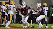 Oct 24, 2025; Blacksburg, Virginia, USA; Virginia Tech Hokies quarterback Kyron Drones (1) and offensive lineman Aidan Lynch (76) celebrate a touchdown during the first overtime period against the California Golden Bears at Lane Stadium. Mandatory Credit: Brian Bishop-Imagn Images
