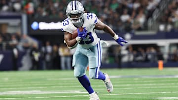 Nov 23, 2025; Arlington, Texas, USA; Dallas Cowboys running back Javonte Williams (33) runs with the ball in the second quarter against the Philadelphia Eagles at AT&T Stadium. Mandatory Credit: Kevin Jairaj-Imagn Images
