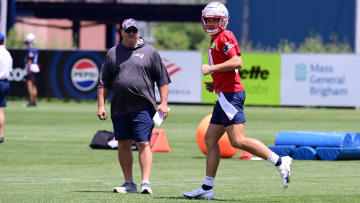 Jun 10, 2024; Foxborough, MA, USA; New England Patriots quarterback Drake Maye (10) works out as offensive coordinator Alex Van Pelt watches at minicamp at Gillette Stadium. Mandatory Credit: Eric Canha-USA TODAY Sports