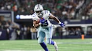 Nov 23, 2025; Arlington, Texas, USA; Dallas Cowboys running back Javonte Williams (33) runs with the ball in the second quarter against the Philadelphia Eagles at AT&T Stadium. 
