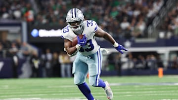 Nov 23, 2025; Arlington, Texas, USA; Dallas Cowboys running back Javonte Williams (33) runs with the ball in the second quarter against the Philadelphia Eagles at AT&T Stadium. 
