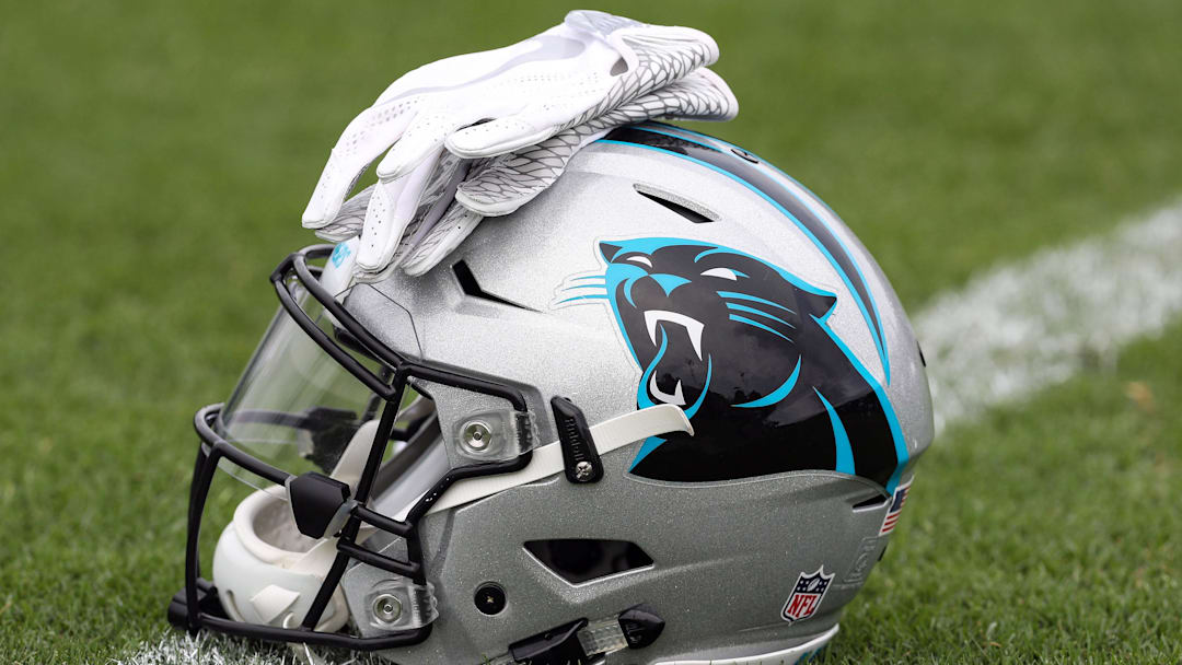 Jul 27, 2017; Spartanburg, SC, USA; Carolina Panthers logo helmet and gloves wait on the turf during Panthers Training Camp at Wofford College. Mandatory Credit: Jim Dedmon-Imagn Images