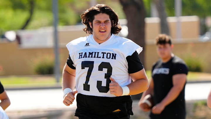 Hamilton tackle Rex Waterman (73) warms up with the offensive line during practice at Hamilton High School at the Chandler Unified School District Spring Football Jamboree on May 14, 2024, in Chandler. Hamilton tackle Rex Waterman (73) warms up with the offensive line during practice at Hamilton High School at the Chandler Unified School District Spring Football Jamboree on May 14, 2024, in Chandler.
