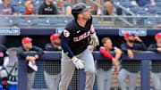 Feb 26, 2024; Peoria, Arizona, USA;  Cleveland Guardians right fielder Chase DeLauter (6) hits a two run home run in the second inning against the San Diego Padres during a spring training game at Peoria Sports Complex. Mandatory Credit: Matt Kartozian-Imagn Images