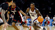Mar 20, 2025; Wichita, KS, USA; Gonzaga Bulldogs guard Khalif Battle (99) dribbles against Georgia Bulldogs guard Tyrin Lawrence (7) in the second half of a first round men’s NCAA Tournament game at Intrust Bank Arena. 