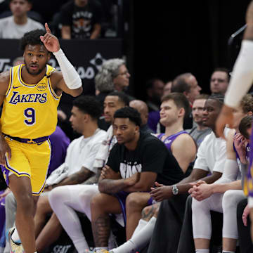 Feb 12, 2025; Salt Lake City, Utah, USA;  Los Angeles Lakers guard Bronny James (9) celebrates after making a three point basket during the second half against the Utah Jazz at Delta Center. Mandatory Credit: Chris Nicoll-Imagn Images