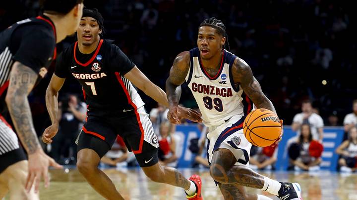 Mar 20, 2025; Wichita, KS, USA; Gonzaga Bulldogs guard Khalif Battle (99) dribbles against Georgia Bulldogs guard Tyrin Lawrence (7) in the second half of a first round men’s NCAA Tournament game at Intrust Bank Arena. Mandatory Credit: Nick Tre. Smith-Imagn Images