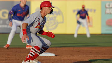 Mar 14, 2025; Port St. Lucie, Florida, USA;  St. Louis Cardinals outfielder Michael Helman (13) takes a lead off second base during the third inning against the New York Mets at Clover Park. Mandatory Credit: Reinhold Matay-Imagn Images