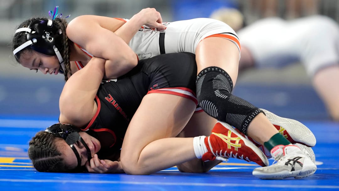 Westmoore's Kyrain Perez, bottom, wrestles Tulsa Union's Kylee Tran in the girls Class 6A 100-pound bout during the OSSAA state wrestling championships at OG&E Coliseum at the OKC Fairgrounds in Oklahoma City, Saturday, Feb. 28, 2026. Westmoore's Kyrain Perez, bottom, wrestles Tulsa Union's Kylee Tran in the girls Class 6A 100-pound bout during the OSSAA state wrestling championships at OG&E Coliseum at the OKC Fairgrounds in Oklahoma City, Saturday, Feb. 28, 2026.
