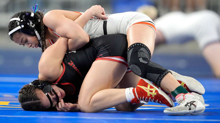 Westmoore's Kyrain Perez, bottom, wrestles Tulsa Union's Kylee Tran in the girls Class 6A 100-pound bout during the OSSAA state wrestling championships at OG&E Coliseum at the OKC Fairgrounds in Oklahoma City, Saturday, Feb. 28, 2026.