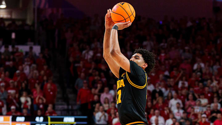 Mar 8, 2026; Lincoln, Nebraska, USA; Iowa Hawkeyes guard Kael Combs (11) shoots a three-point shot to force overtime against the Nebraska Cornhuskers during the second half at Pinnacle Bank Arena. Mandatory Credit: Dylan Widger-Imagn Images