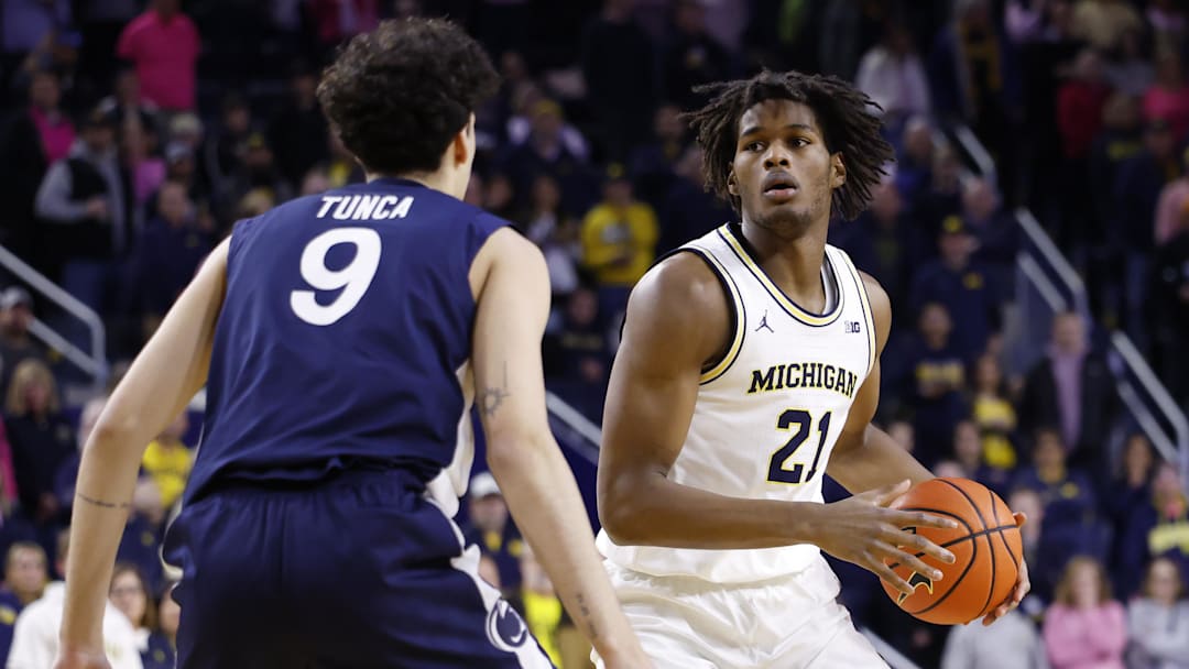 Feb 5, 2026; Ann Arbor, Michigan, USA;  Michigan Wolverines forward Morez Johnson Jr. (21) dribbles against Penn State Nittany Lions guard Melih Tunca (9) in the first half at Crisler Center. Mandatory Credit: Rick Osentoski-Imagn Images