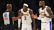 Mar 22, 2025; Los Angeles, California, USA; Los Angeles Lakers forward Jarred Vanderbilt (2) and Los Angeles Lakers forward LeBron James (23) react to a call from referee Courtney Kirkland (61) against the Chicago Bulls during the first half at Crypto.com Arena. Mandatory Credit: Jonathan Hui-Imagn Images