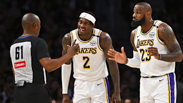Mar 22, 2025; Los Angeles, California, USA; Los Angeles Lakers forward Jarred Vanderbilt (2) and Los Angeles Lakers forward LeBron James (23) react to a call from referee Courtney Kirkland (61) against the Chicago Bulls during the first half at Crypto.com Arena. Mandatory Credit: Jonathan Hui-Imagn Images