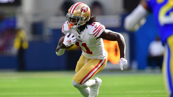 Oct 30, 2022; Inglewood, California, USA; San Francisco 49ers wide receiver Brandon Aiyuk (11) runs the ball against the Los Angeles Rams during the first half at SoFi Stadium. Mandatory Credit: Gary A. Vasquez-USA TODAY Sports