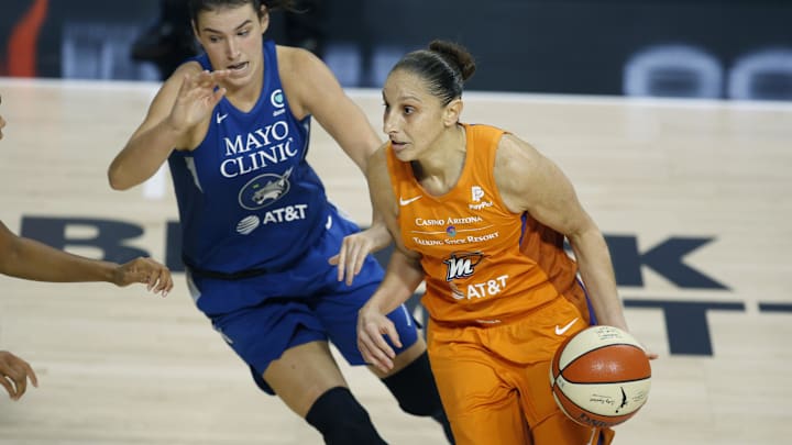 Sep 17, 2020; Palmetto, Florida, USA; Phoenix Mercury guard Diana Taurasi (right) drives around Minnesota Lynx guard Bridget Carleton (left) during the second half at the FELD entertainment complex. Mandatory Credit: Reinhold Matay-Imagn Images 