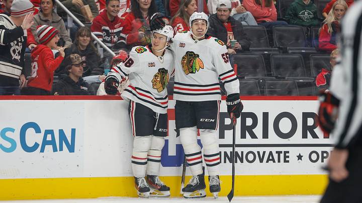 Nov 9, 2025; Detroit, Michigan, USA;  Chicago Blackhawks center Connor Bedard (98) celebrates with defenseman Artyom Levshunov (55) after scoring a goal in the first period at Little Caesars Arena. Mandatory Credit: Brian Bradshaw Sevald-Imagn Images