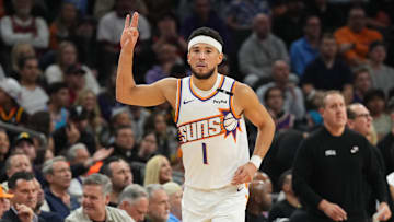 Nov 4, 2024; Phoenix, Arizona, USA; Phoenix Suns guard Devin Booker (1) reacts against the Philadelphia 76ers during the first half at Footprint Center. Mandatory Credit: Joe Camporeale-Imagn Images