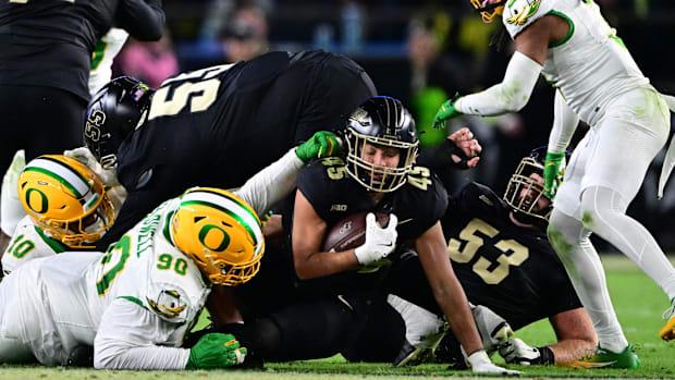 Oct 18, 2024; West Lafayette, Indiana, USA; Purdue Boilermakers running back Devin Mockobee (45) is tackled by Oregon Ducks d