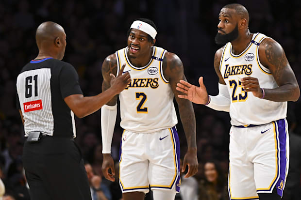 Los Angeles Lakers forward Jarred Vanderbilt (2) and Los Angeles Lakers forward LeBron James (23) react to a call from refere