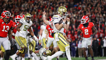 Nov 29, 2024; Athens, Georgia, USA; Georgia Tech Yellow Jackets quarterback Haynes King (10) runs for a touchdown against the Georgia Bulldogs in the second quarter at Sanford Stadium. Mandatory Credit: Brett Davis-Imagn Images