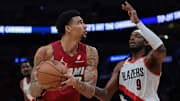 Jan 21, 2025; Miami, Florida, USA; Miami Heat center Kel'el Ware (7) drives to the basket against Portland Trail Blazers forward Jerami Grant (9) during the second quarter at Kaseya Center. Mandatory Credit: Sam Navarro-Imagn Images