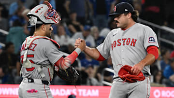 Boston Red Sox catcher Carlos Narvaez (75) and relief pitcher Payton Tolle (70) celebrate a win over the Toronto Blue Jays at Rogers Centre.