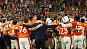 Oct 18, 2025; Charlottesville, Virginia, USA; Virginia Cavaliers players and staff sign the school song in font of the student sections after their game against the Washington State Cougars at Scott Stadium. Mandatory Credit: Geoff Burke-Imagn Images