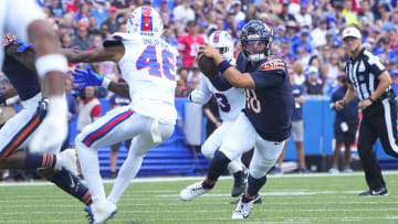 Aug 10, 2024; Orchard Park, New York, USA; Chicago Bears quarterback Caleb Williams (18) runs with the ball against Buffalo Bills cornerback Ja'Marcus Ingram (46)during the first half at Highmark Stadium. Mandatory Credit: Gregory Fisher-USA TODAY Sports