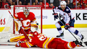 Nov 5, 2025; Calgary, Alberta, CAN; Calgary Flames goaltender Dustin Wolf (32) guards his net against the Columbus Blue Jackets during the third period at Scotiabank Saddledome. Mandatory Credit: Sergei Belski-Imagn Images