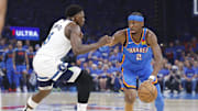 Gilgeous-Alexander drives against Edwards during Game 2 of the Western Conference finals.
