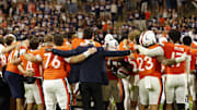 Oct 18, 2025; Charlottesville, Virginia, USA; Virginia Cavaliers players and staff sign the school song in font of the student sections after their game against the Washington State Cougars at Scott Stadium. Mandatory Credit: Geoff Burke-Imagn Images